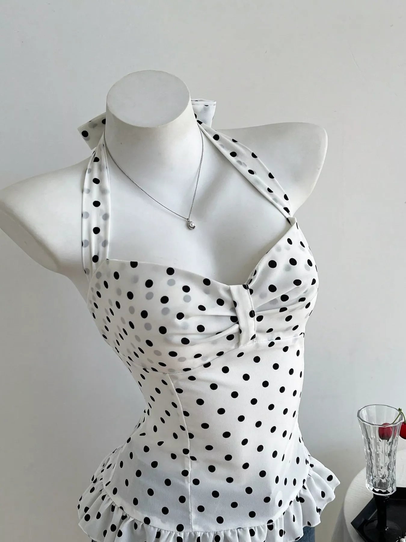 Trendsi polka dot halter cami with buttoned bust and ruffled peplum, thin straps
