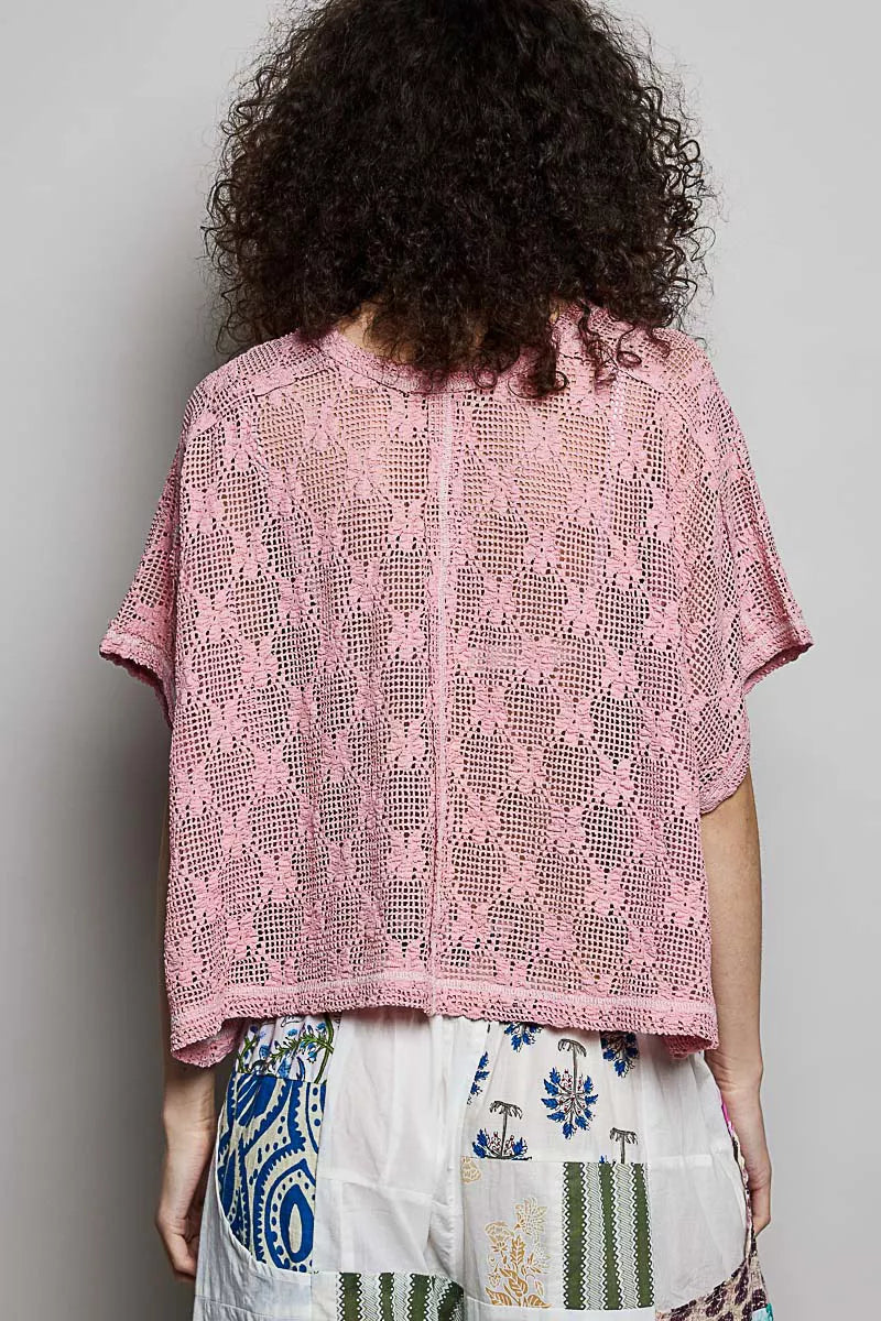Dusty rose crochet lace short-sleeve top, back view with yoke seam