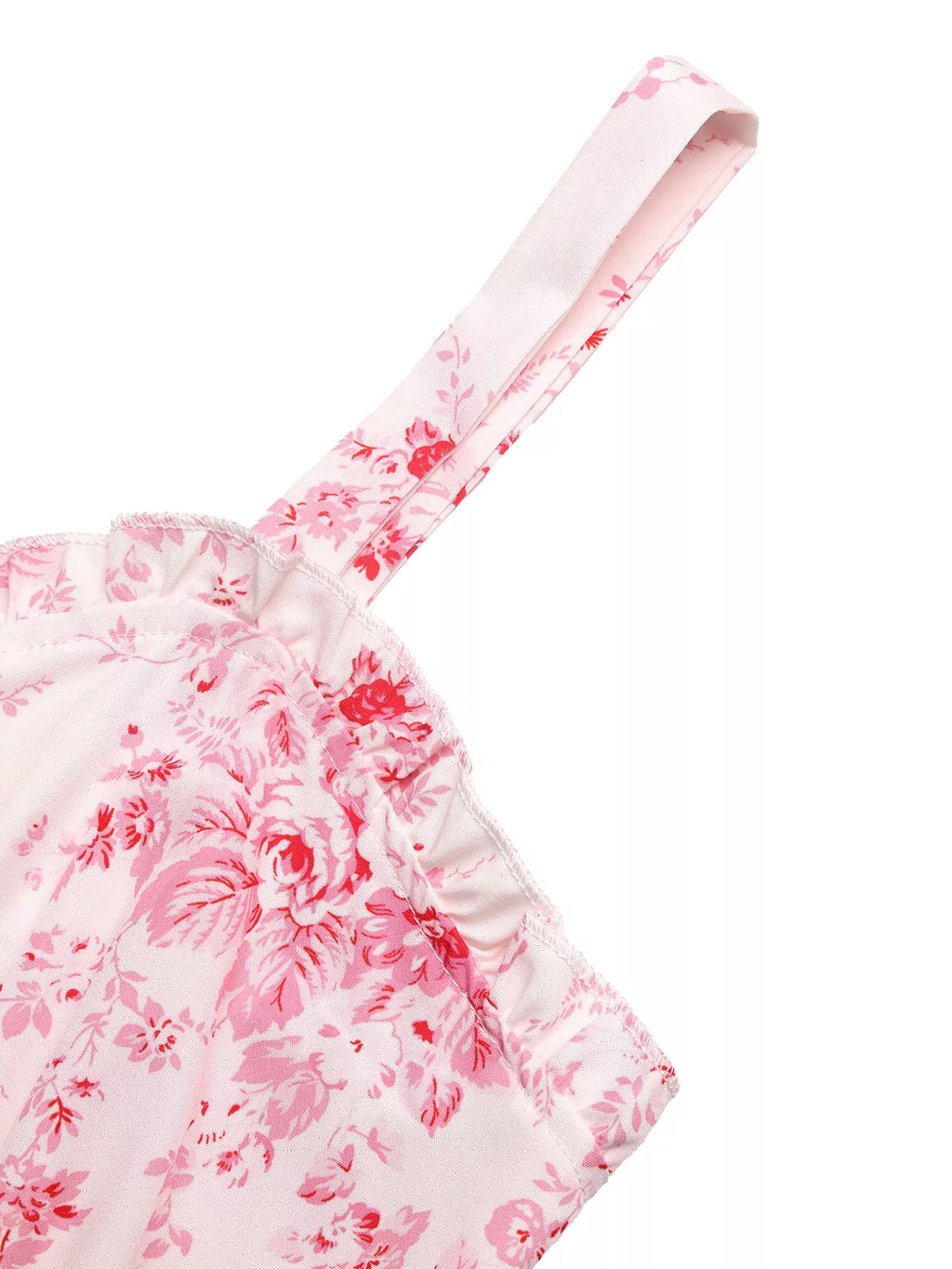 Pink floral cami dress detail with thin strap and ruffled neckline edge