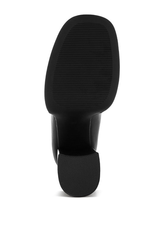 Black loafer outsole with textured grip and thick heel base