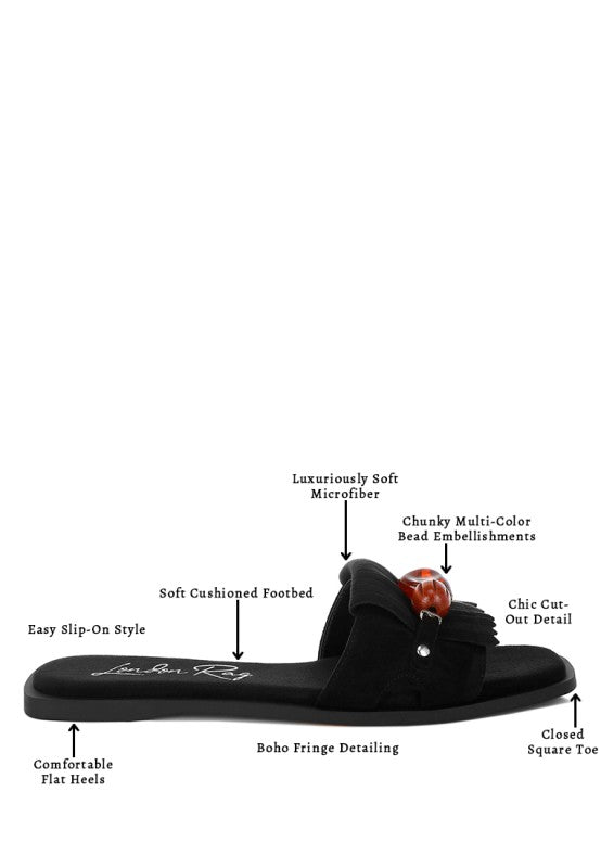 Black microfiber beaded slip-on flat sandals with boho fringe and closed square toe