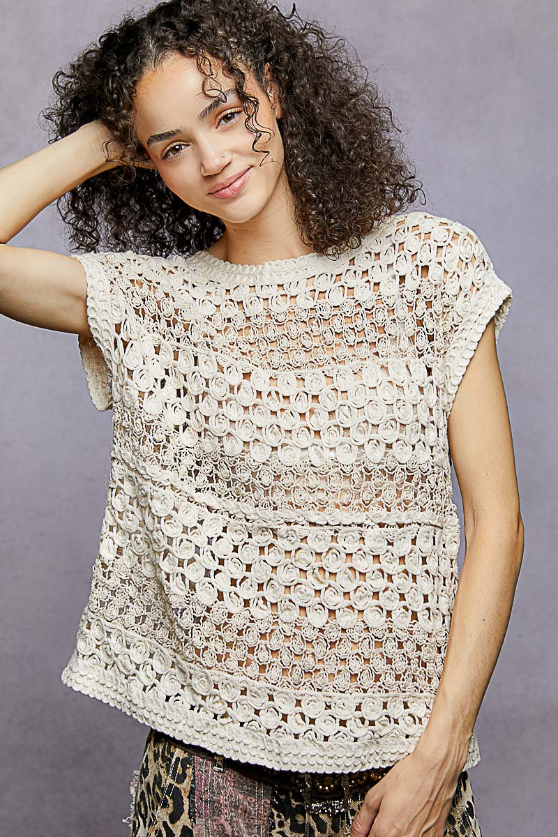 Natural round-neck crochet top with openwork lattice texture and fitted waist band