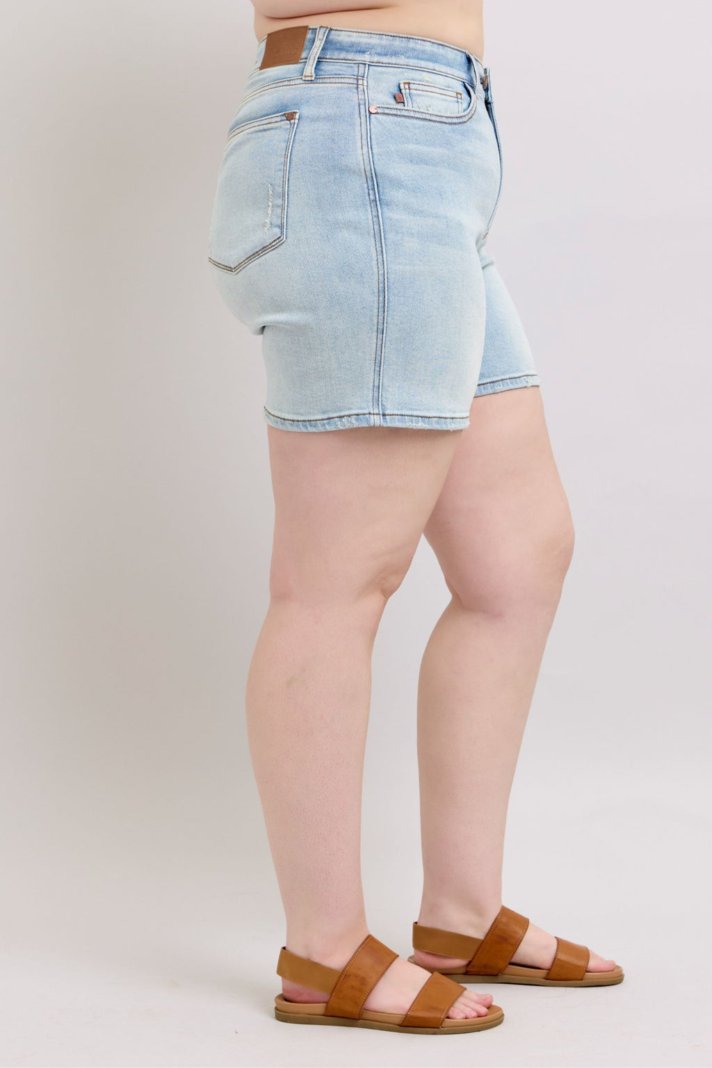 Light-wash denim shorts, back view, belt loops and back pockets