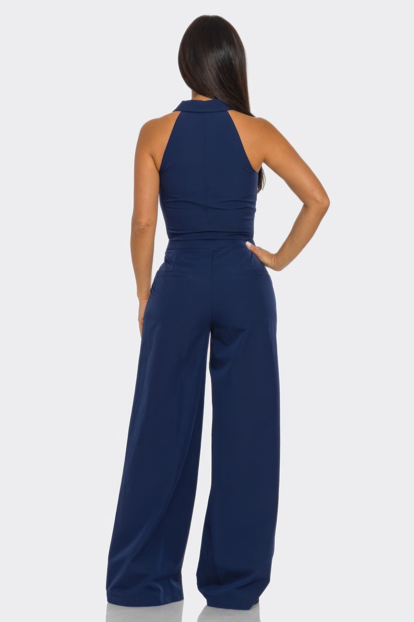 Back view of navy color block 2-piece set: sleeveless crop vest and wide-leg pants