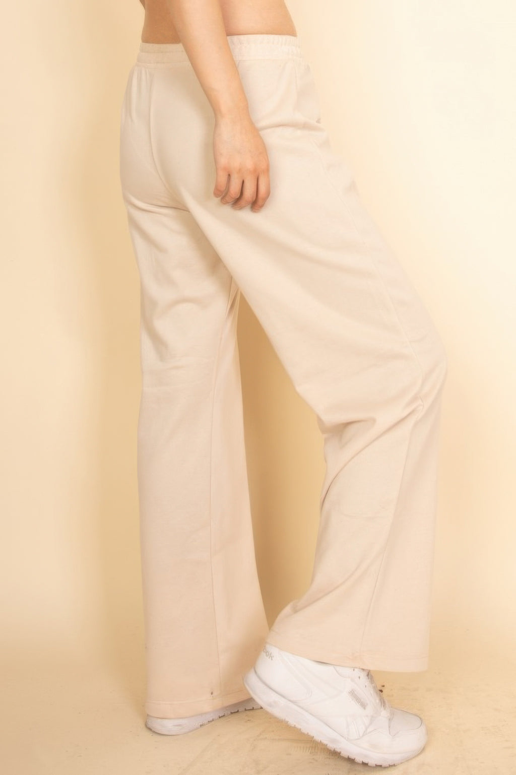 Wide-leg lounge pants in pale pink with elastic drawstring waistband