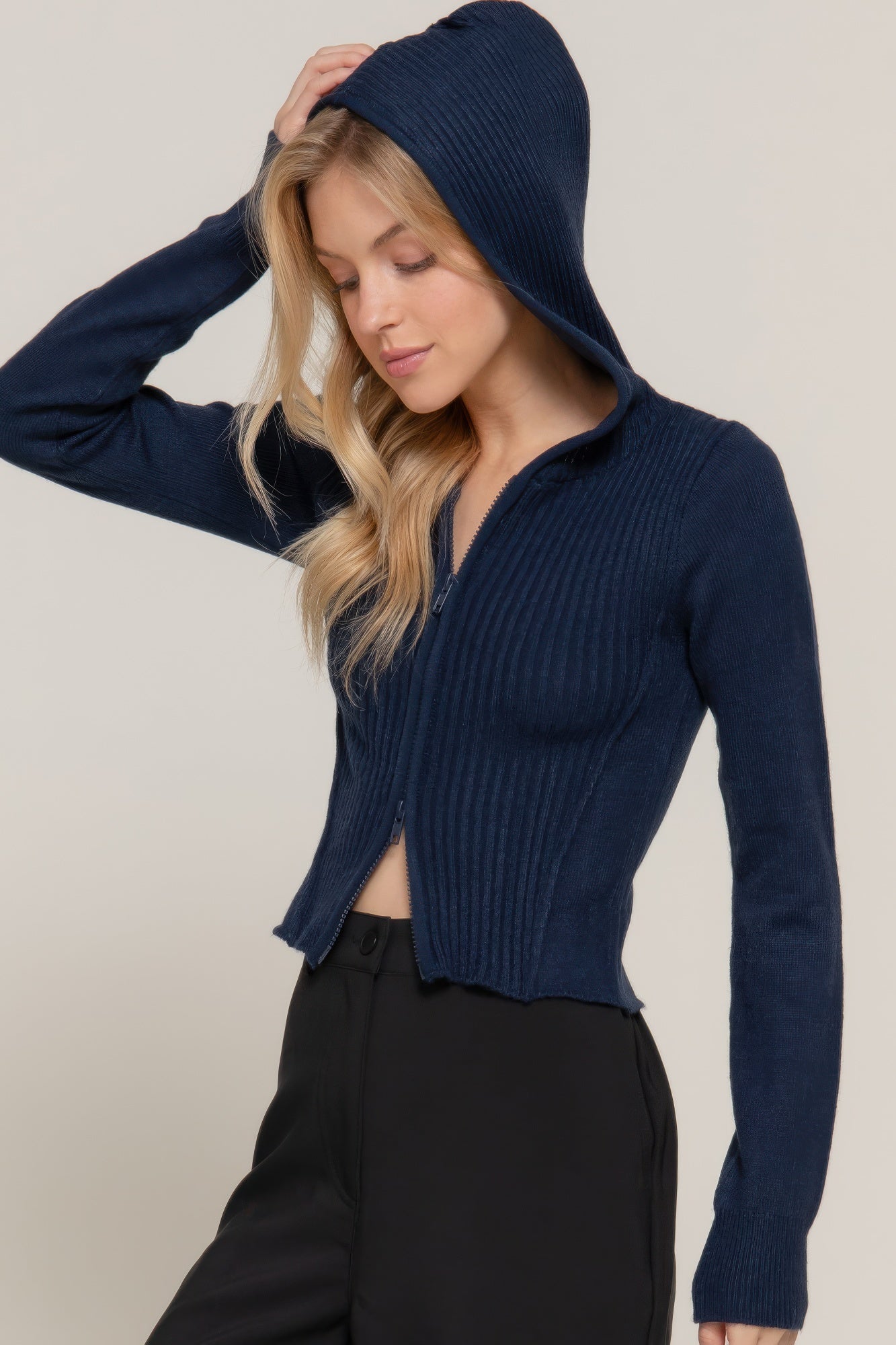 Navy sweater hoodie with hood up and two-way zipper, ribbed knit