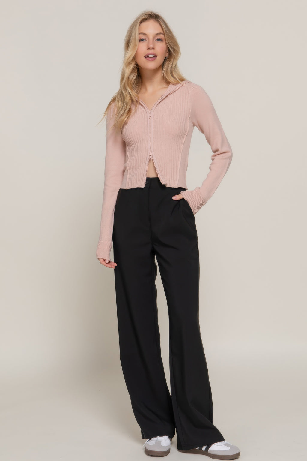 Beige pink 2-way zip sweater hoodie cardigan worn with wide-leg black pants