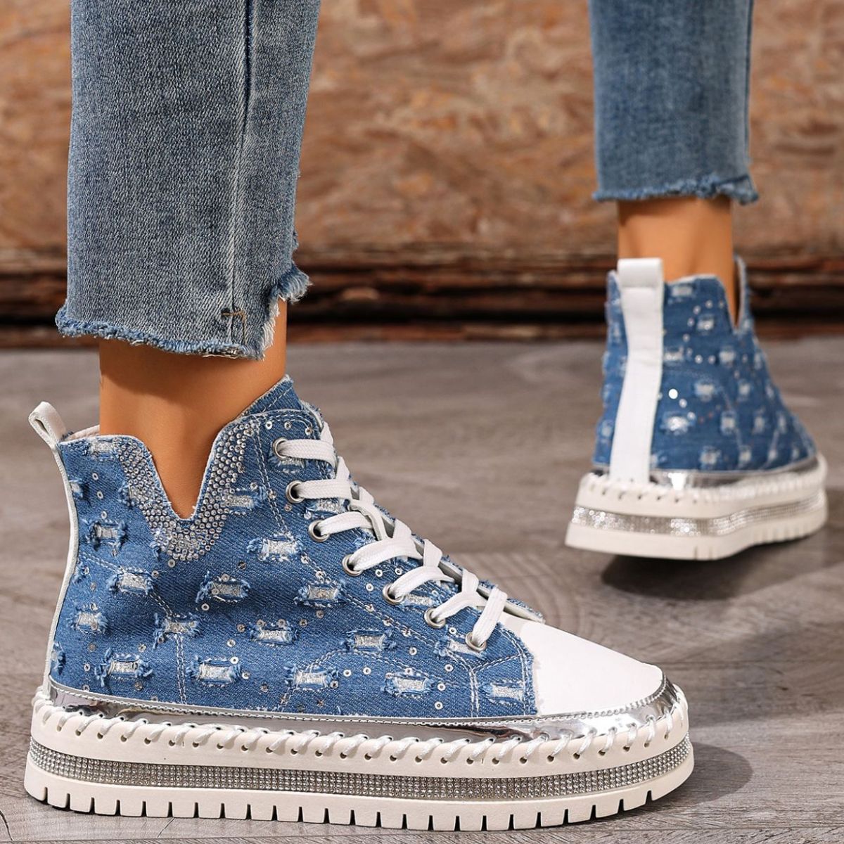 Blue lace-up platform sneakers, heel/side view with thick tread sole and loop pull-tab