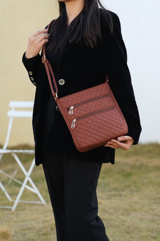 MKF quilted cotton crossbody bag with quilted pattern, dual zip pockets, crossbody strap