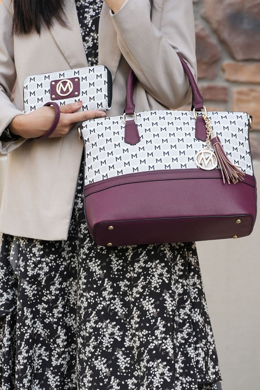 Burgundy tote bag with M logo pattern, tassel charm, and matching zip wallet pouch