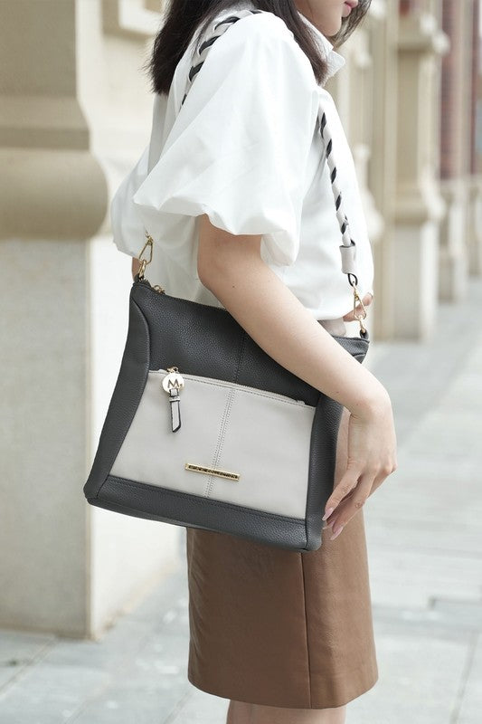 Nala shoulder bag in black with light front panel, top zip and braided crossbody strap