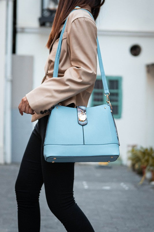 Snake vegan leather shoulder bag in light blue with top handle and charm detail