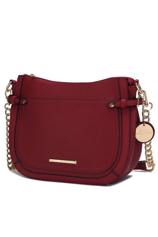 Red Raelynn shoulder bag with chain strap, front flap pocket, and gold-tone bar detail