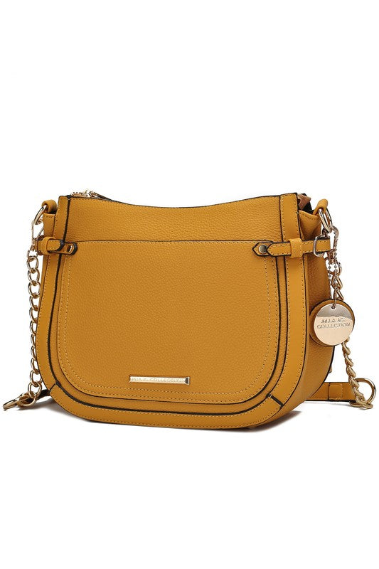 Yellow Raelynn crossbody bag with front flap, gold-tone bar detail, and chain strap