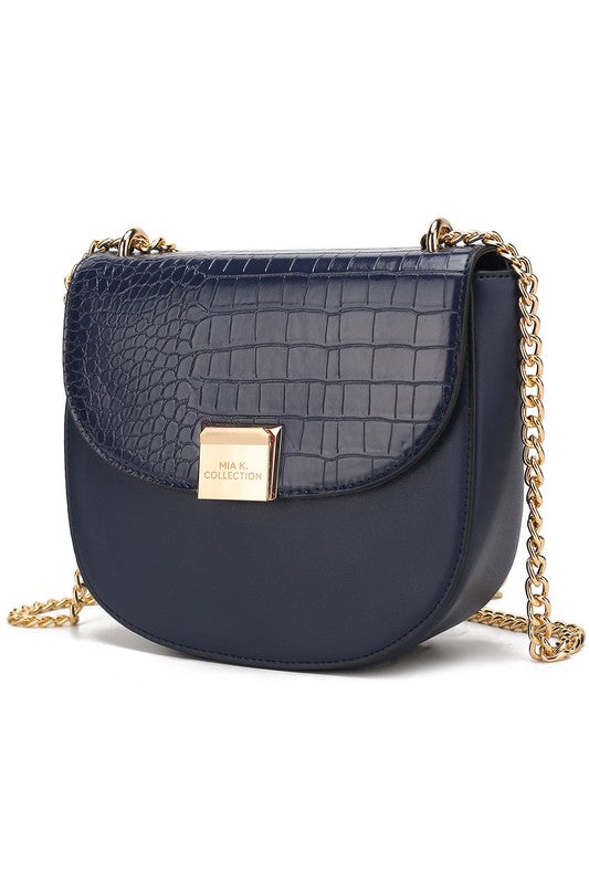 Brooklyn crossbody bag in navy croc-texture with gold chain strap and flap.
