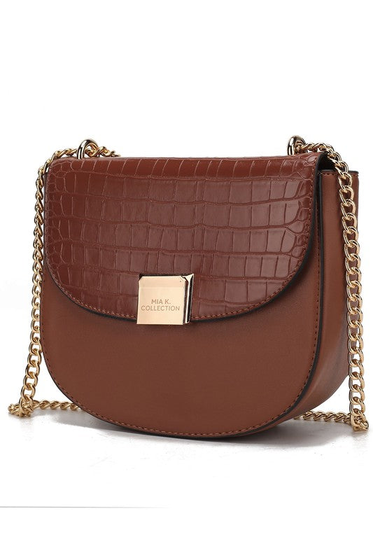 Brooklyn crossbody bag in wine brown croc-texture with gold chain and flap.