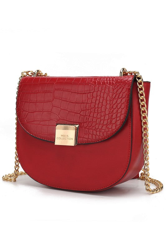 Brooklyn crossbody bag in wine-red croc-texture with gold chain and clasp flap.