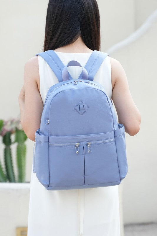 Light blue Tatum backpack with double front zips and adjustable shoulder straps