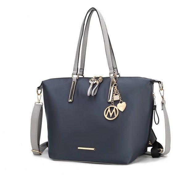 Navy Layla tote backpack with light gray handles and gold-tone M charm