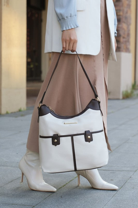 Two-tone vegan leather shoulder bag, white body with dark trim, drawstring top