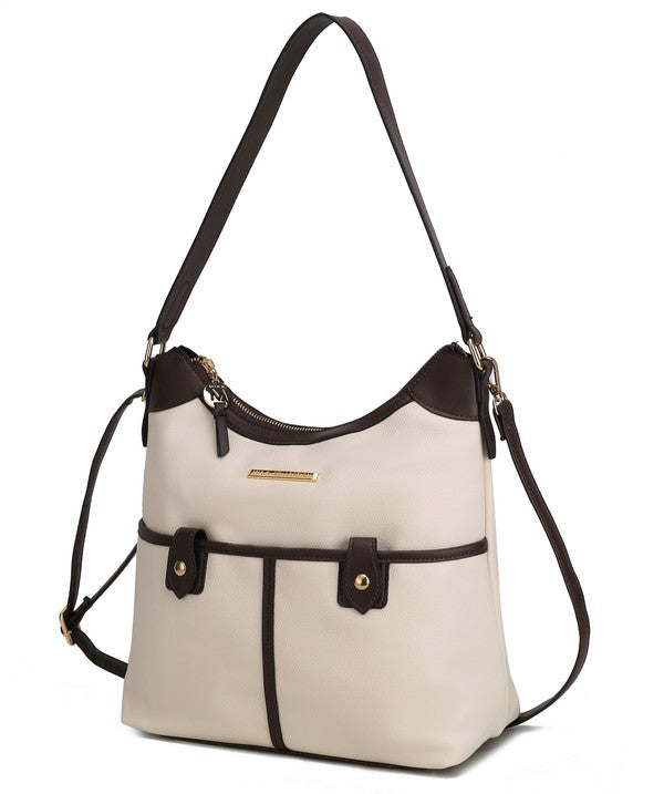Beige vegan leather shoulder bag with gold bar logo and buckle front tabs