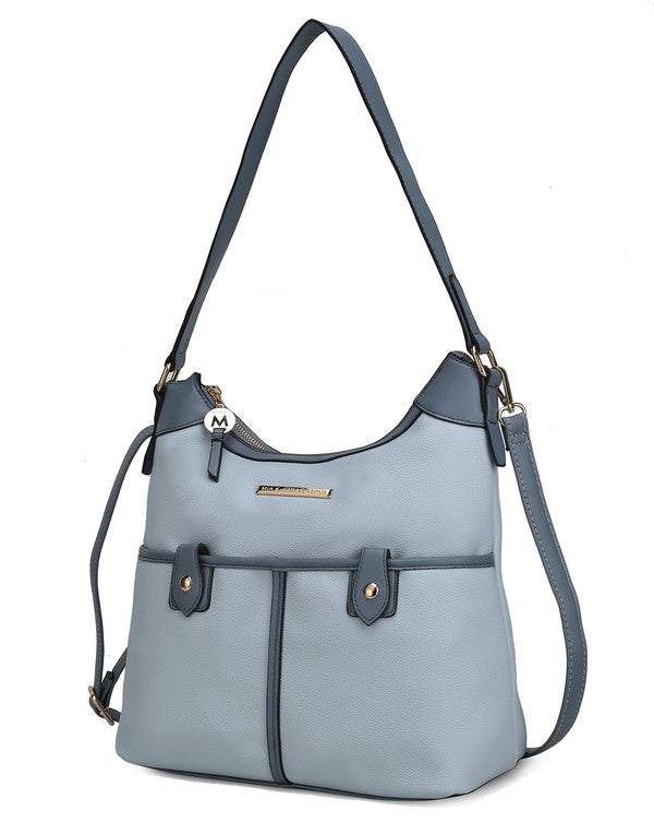 Light blue vegan leather shoulder bag with dark blue trim, zip top, front patch pockets