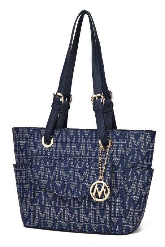 Navy signature tote bag with gold-tone logo medallion, chain accent, and straps