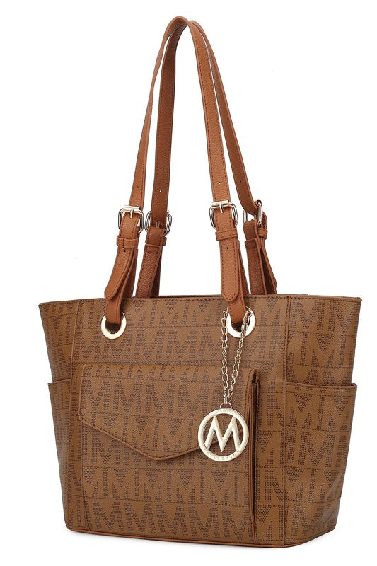 Tan Griselda tote bag with front M medallion, chain detail, and long handles
