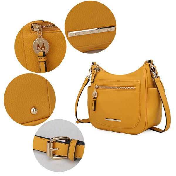 Wally handbag details: logo zip pull, textured finish, metal studs, shoulder strap.