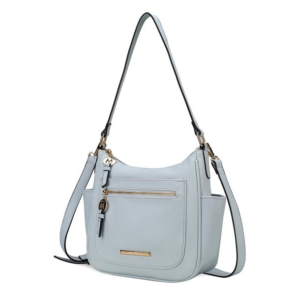 Wally shoulder bag in light blue with front zip pocket, gold bar detail, and shoulder strap