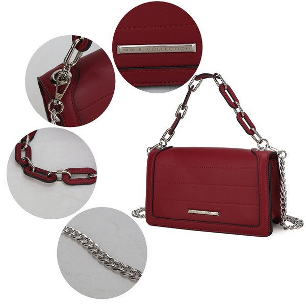 Wine red Dora crossbody close-up: chain strap, flap stitching, and logo bar