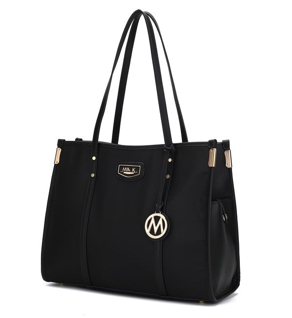 Oversize tote in black with long handles, front logo patch, and gold-ring M charm
