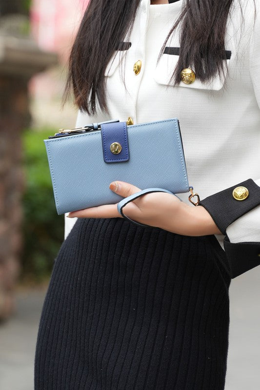 Solene vegan leather wristlet wallet in denim-blue with snap front and gold hardware