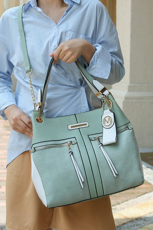 Light green Sofia tote with keyring charm, front zip compartments and shoulder handles
