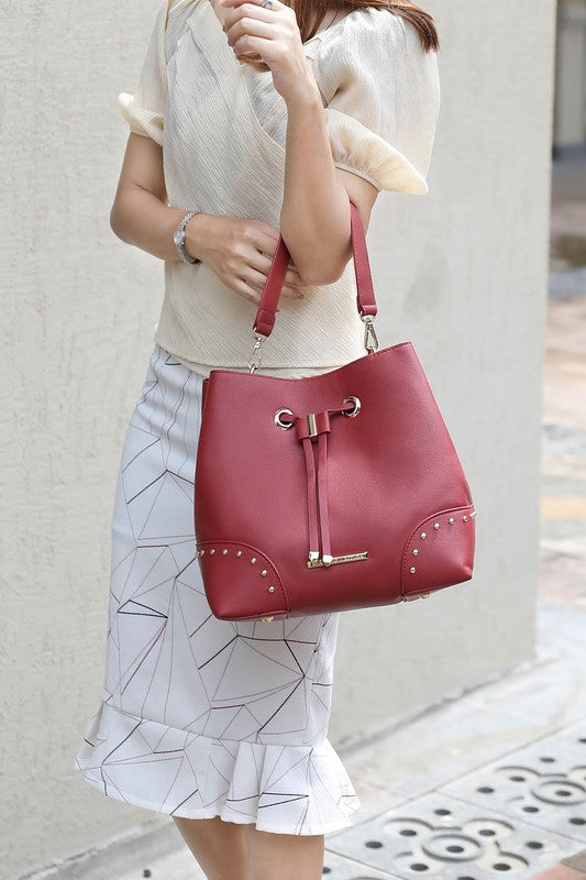Wine red Bella bucket bag with gold studs, drawstring top, includes wristlet