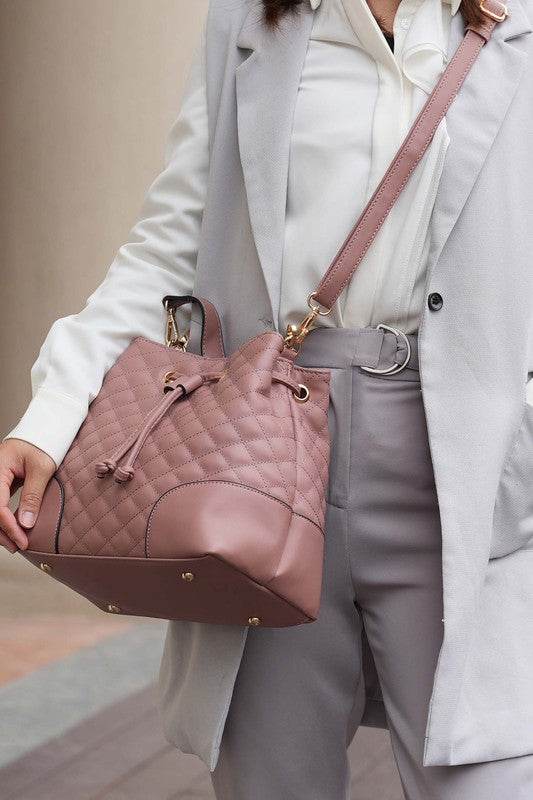 Mauve Wendy bucket bag with wristlet strap, quilted pattern, and drawstring cord