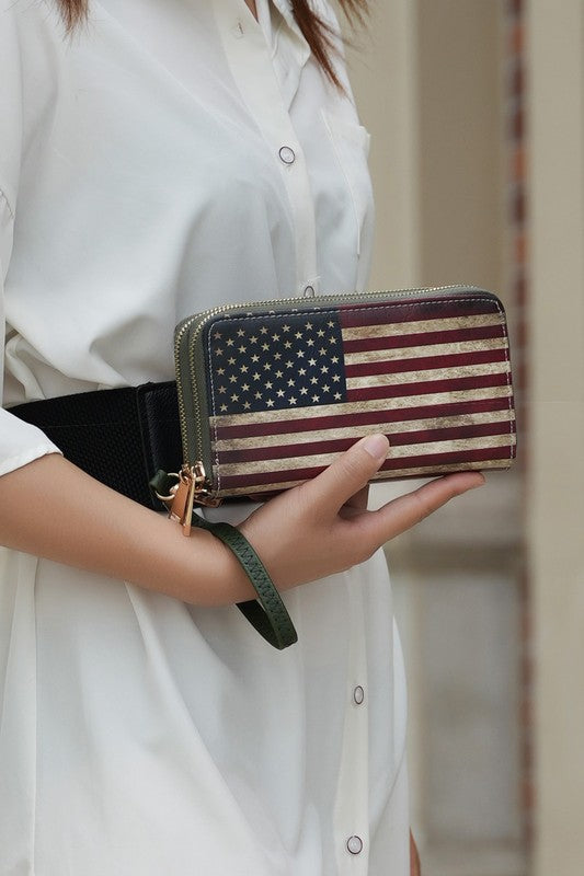Uriel wristlet wallet with American flag print, zip closure, wrist strap attached