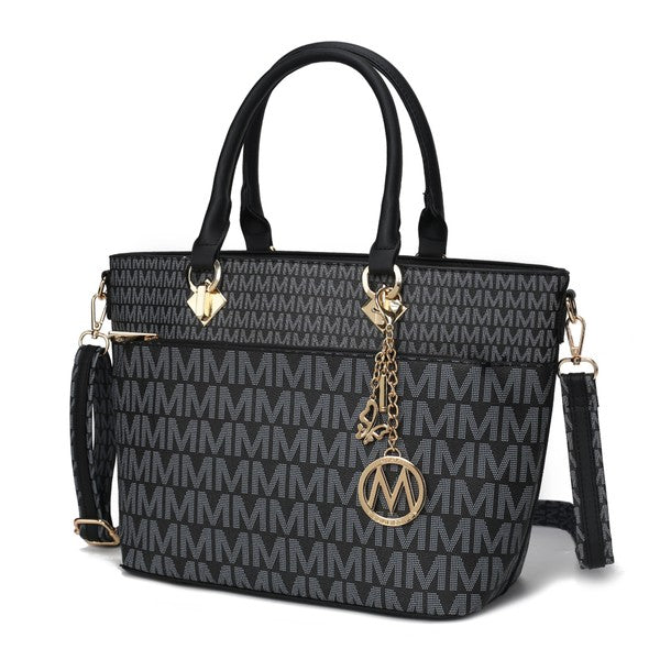Yonah Signature tote bag in black with repeating monogram pattern, gold logo charm, and tassel