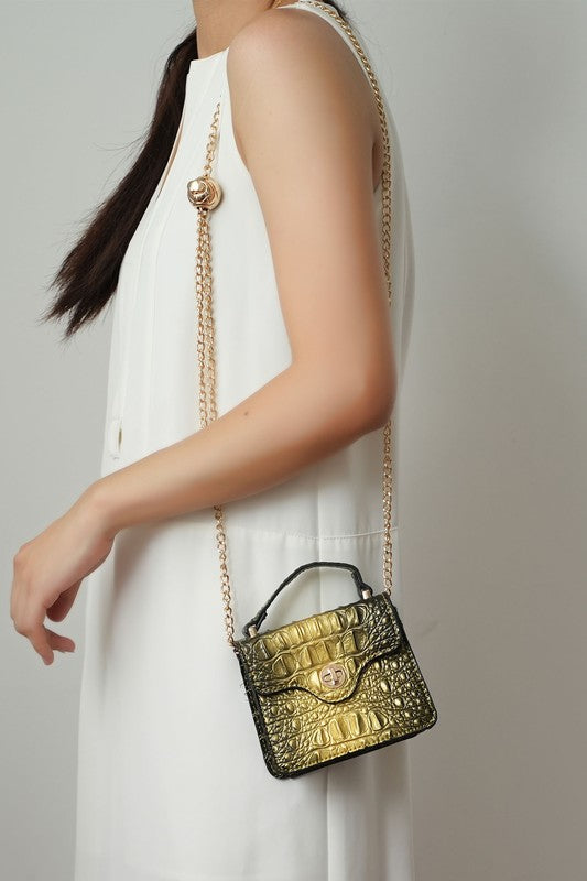 Gold mini satchel with chain strap, front turn-lock and croc texture