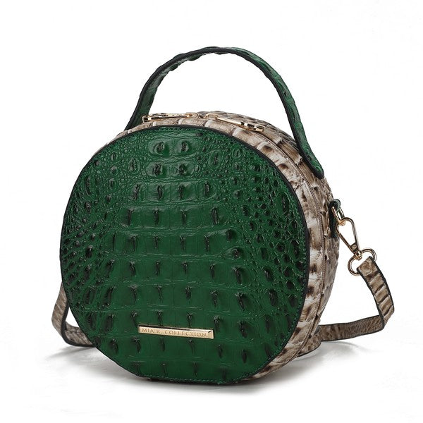 Green croc-embossed round crossbody bag with top handle and adjustable strap
