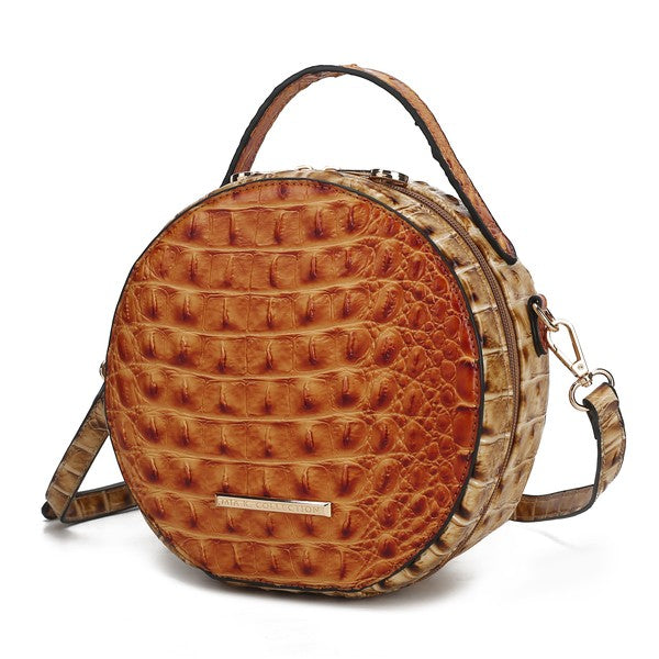Cognac brown croc-embossed round crossbody bag with top handle and front plaque