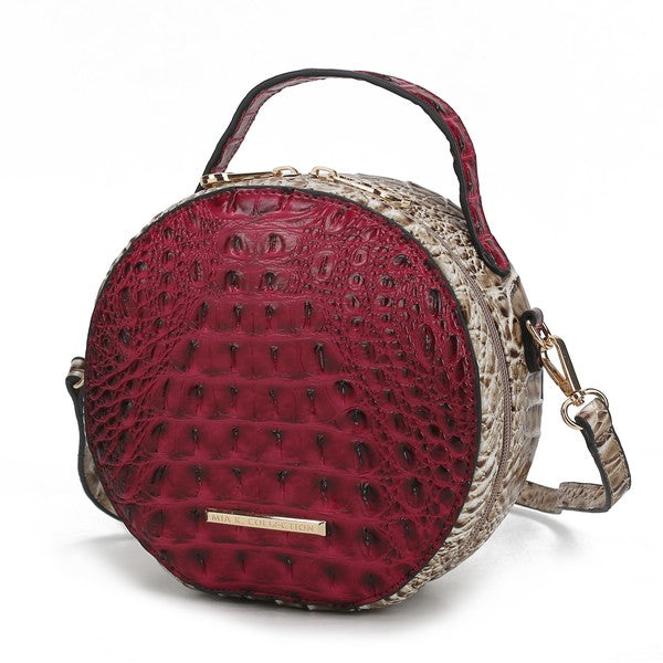 Fuchsia and neutral croc-embossed round crossbody bag with gold zipper bar