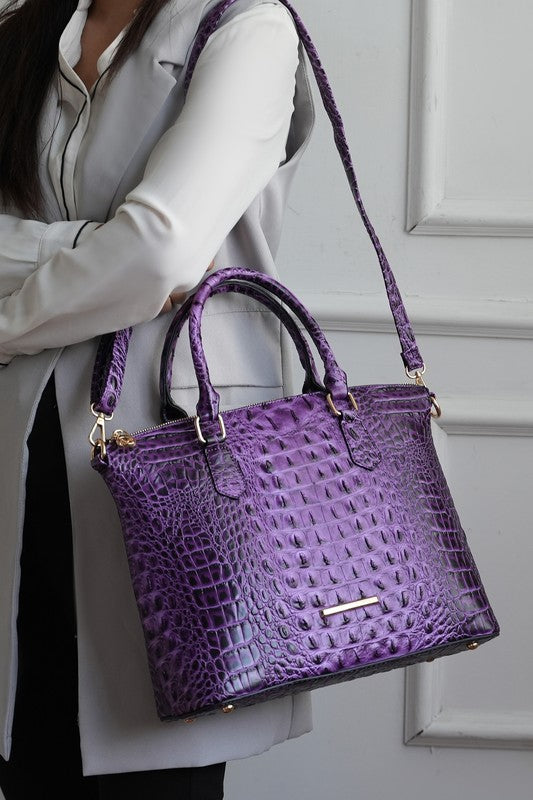 Purple croc-embossed tote with mini pouch and shoulder strap, gold-tone hardware.