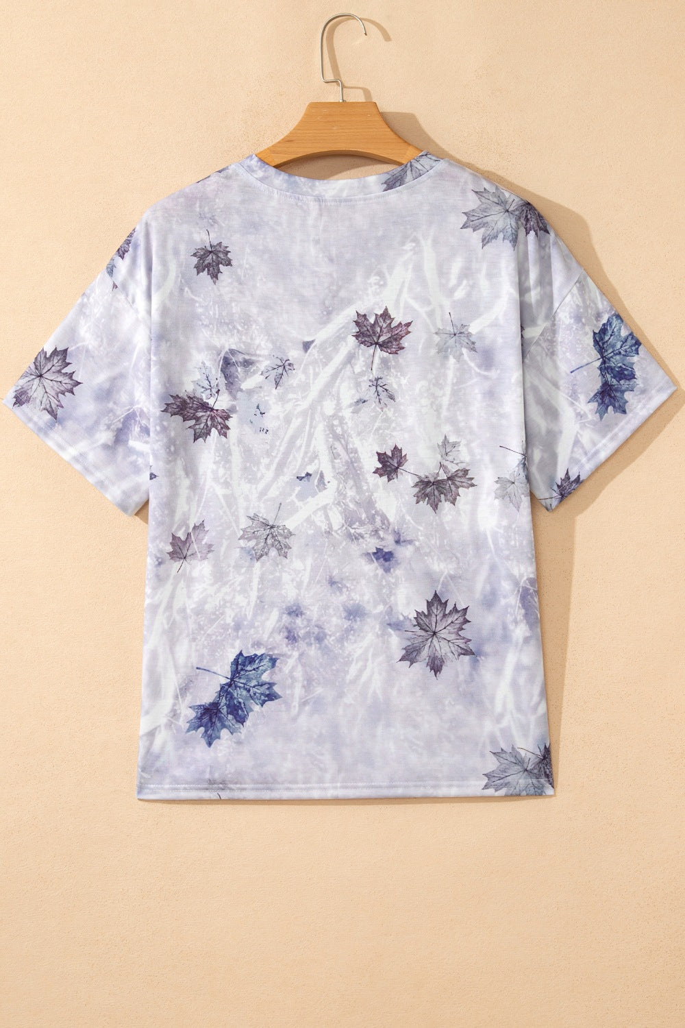Light gray tunic tee with woodland camouflage leaf print on back, short sleeves