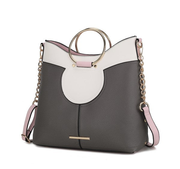 Charcoal gray and white top handle satchel with oval front cutout and pink accents.