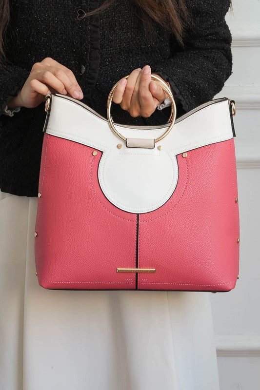 Pink and white top handle satchel with circular front detail and chain handles.