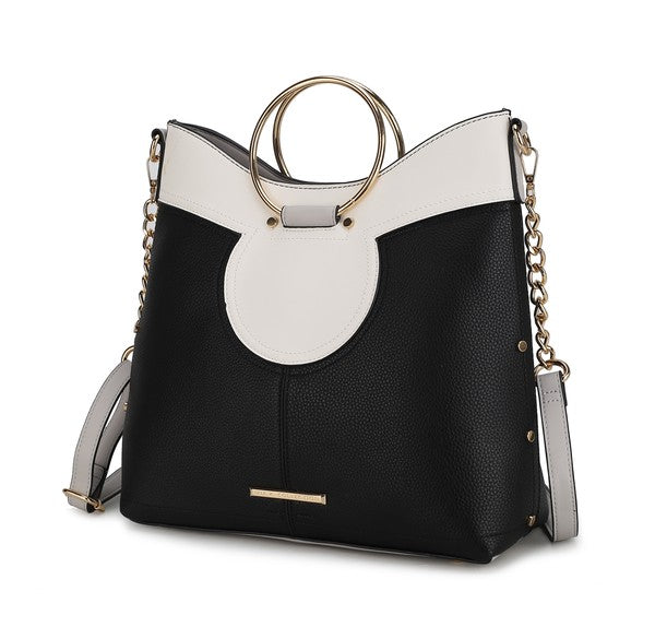 Black and white top handle satchel with oval front cutout and gold-tone chain strap.