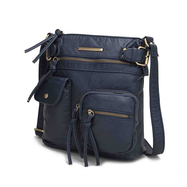 Navy blue crossbody bag with front zip pocket, tassel details, and adjustable strap