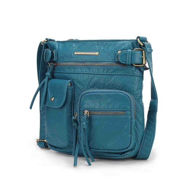 Teal leather-look crossbody bag with front pocket, zip top, and buckle strap