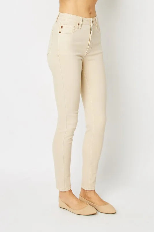 Bone skinny jeans full length, back view with back pockets and seam details